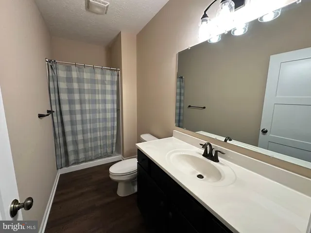 a view of a balcony with yard