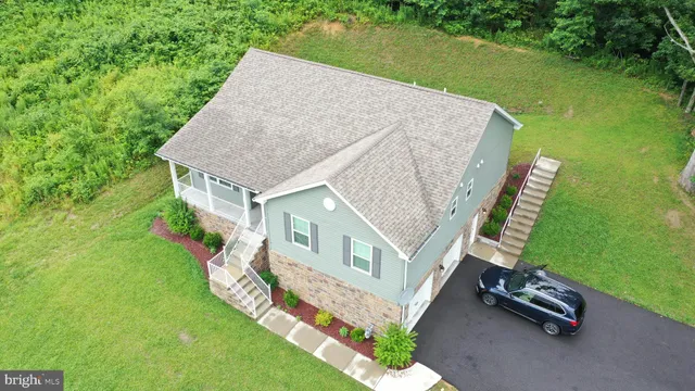 a view of a yard with potted plants