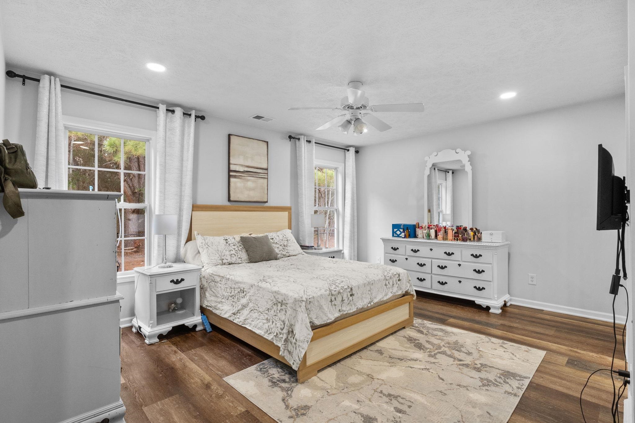 452 West Perry Road Myrtle Beach, SC 29579 - Photo 15 of 26 Bedroom featuring dark wood-type flooring, a ceiling fan, and recessed lighting