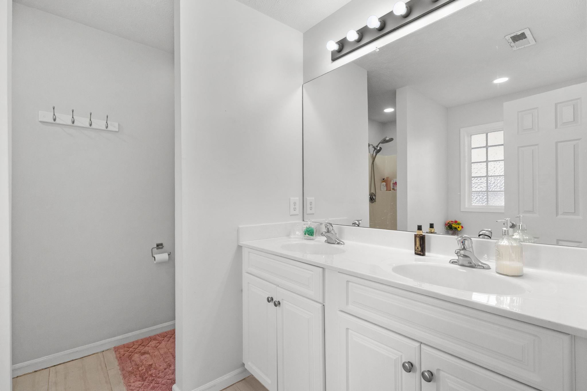 452 West Perry Road Myrtle Beach, SC 29579 - Photo 17 of 26 Bathroom featuring double vanity and a shower