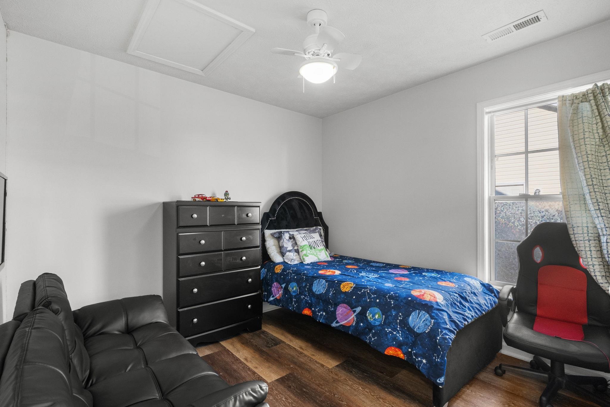 452 West Perry Road Myrtle Beach, SC 29579 - Photo 21 of 26 Bedroom featuring wood finished floors, ceiling fan, and attic access