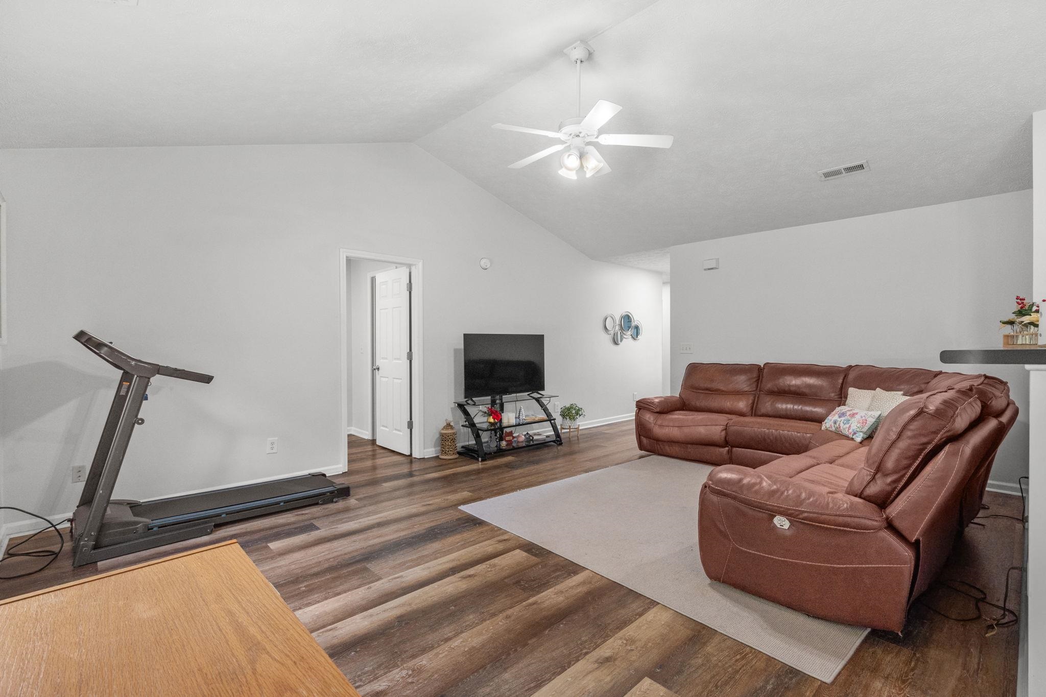 452 West Perry Road Myrtle Beach, SC 29579 - Photo 5 of 26 Living room with vaulted ceiling, dark wood-type flooring, and a ceiling fan