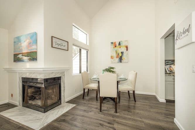 2601 Willowbrook Lane, Unit 6 Aptos, CA 95003 - Photo 20 of 43 a dining room with furniture and a fireplace