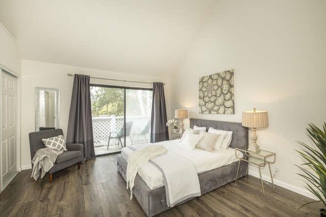 2601 Willowbrook Lane, Unit 6 Aptos, CA 95003 - Photo 27 of 43 a bedroom with a bed and wooden floor