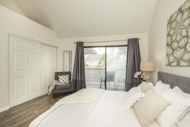 2601 Willowbrook Lane, Unit 6 Aptos, CA 95003 - Photo 28 of 43 a bedroom with a bed and a large window