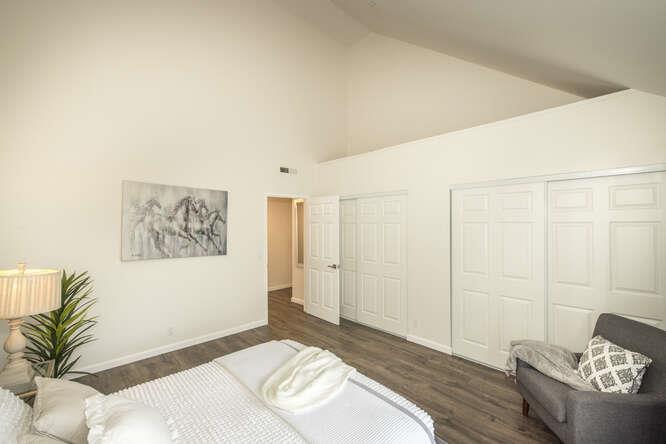 2601 Willowbrook Lane, Unit 6 Aptos, CA 95003 - Photo 29 of 43 a bedroom with a bed and a couch