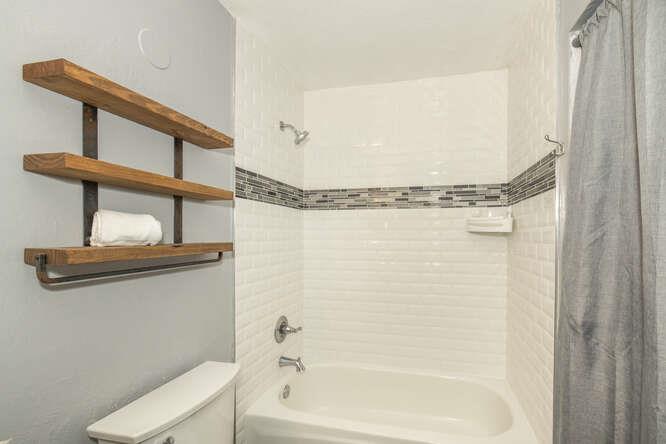 2601 Willowbrook Lane, Unit 6 Aptos, CA 95003 - Photo 35 of 43 a bathroom with a shower a sink and a mirror