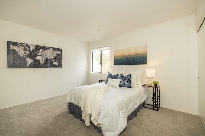 2601 Willowbrook Lane, Unit 6 Aptos, CA 95003 - Photo 39 of 43 a bedroom with a bed and a flat screen tv