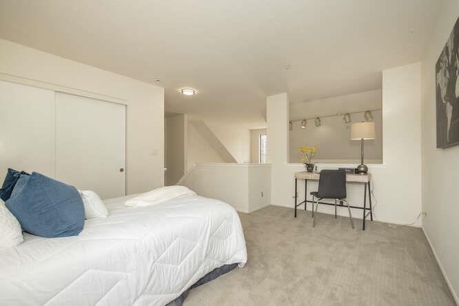 2601 Willowbrook Lane, Unit 6 Aptos, CA 95003 - Photo 41 of 43 a bedroom with a bed and a table