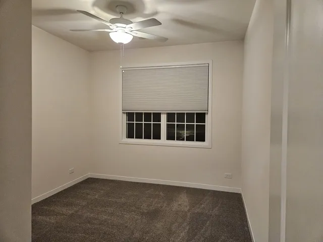 a bathroom with a bathtub shower sink vanity and toilet