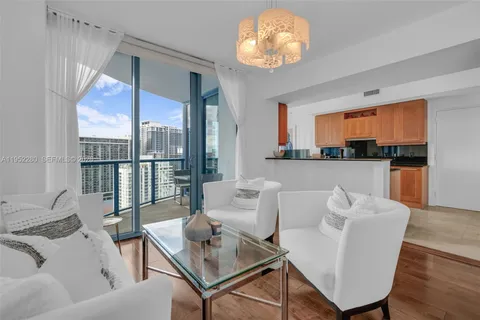 a view of a living room and floor to ceiling window