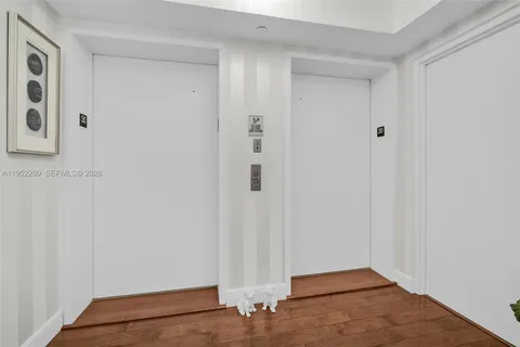 a living room with furniture a rug and a flat screen tv