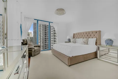 a balcony with furniture and city view