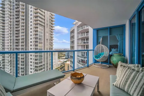 a view of a patio with couches table and chairs and potted plants