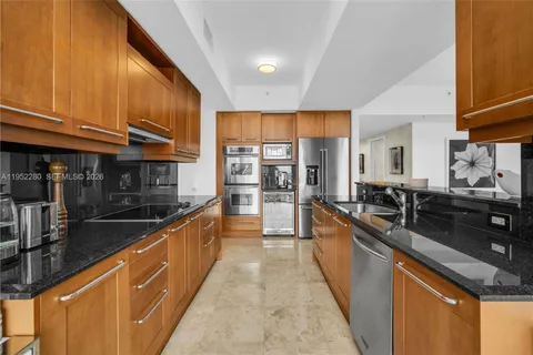 a living room with furniture wooden floor and a large window