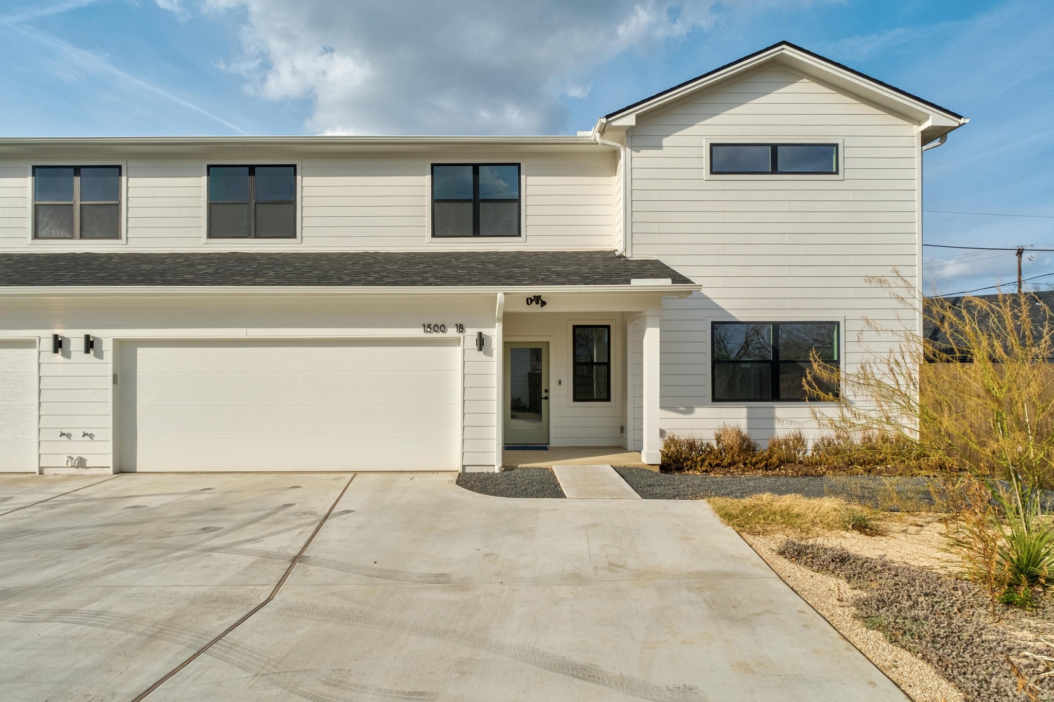 1500 Sylvan Glade, Unit 1B Austin, TX 78745 - Photo 3 of 29 a front view of a house with a yard