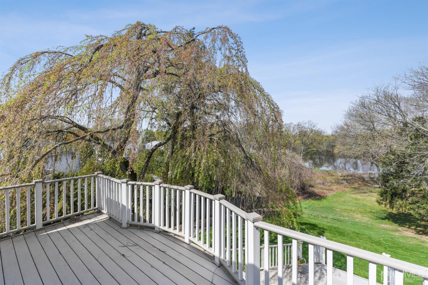 27 Agate Road East Brunswick, NJ 08816 - Photo 16 of 31 a view of a roof deck with wooden fence and floor