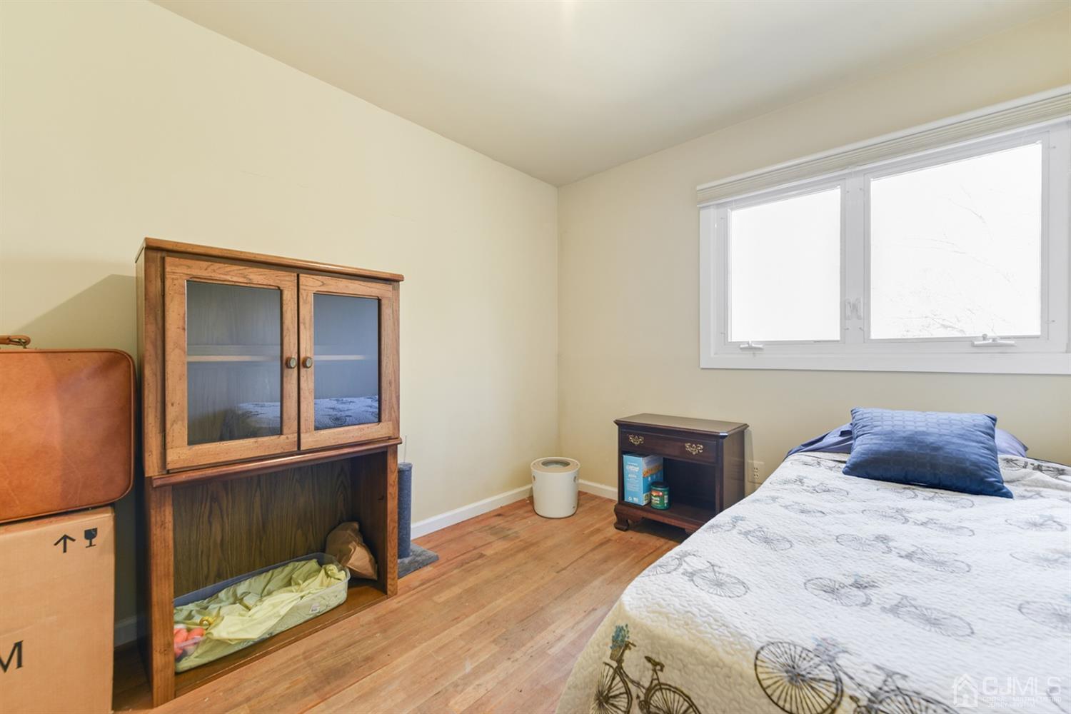 27 Agate Road East Brunswick, NJ 08816 - Photo 17 of 31 a bedroom with a bed and a window