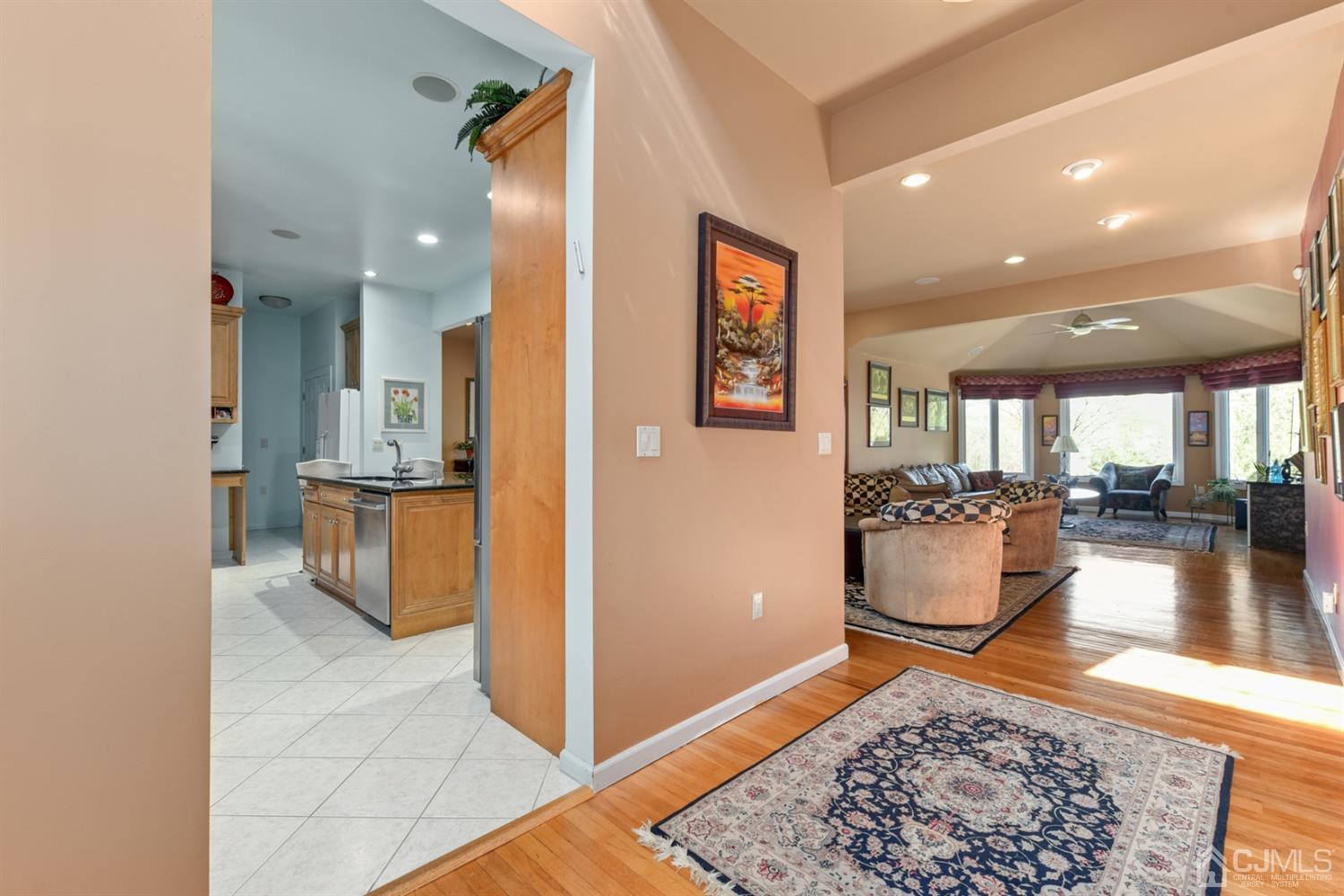 27 Agate Road East Brunswick, NJ 08816 - Photo 3 of 31 a view of a hallway with living room and dining room