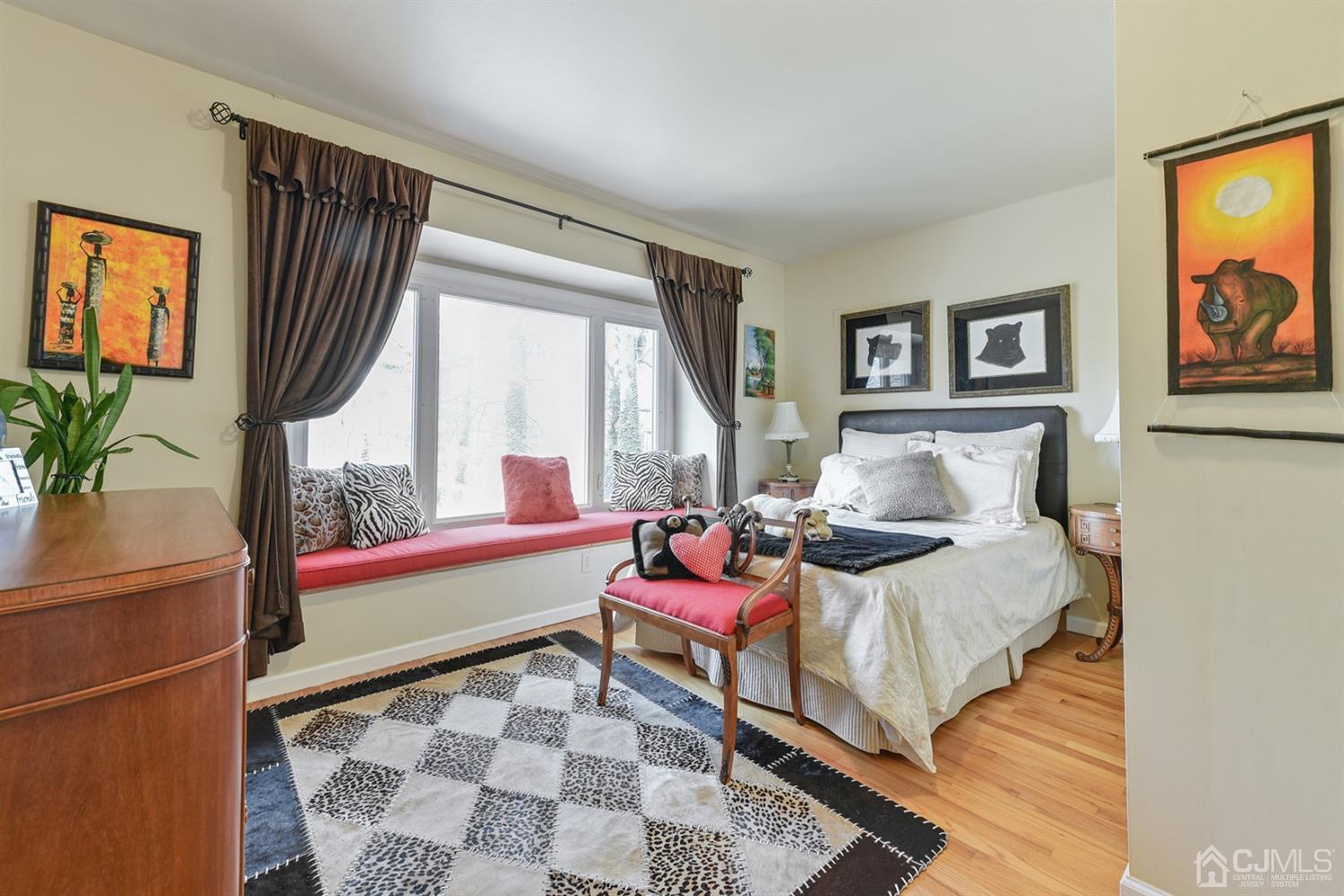 27 Agate Road East Brunswick, NJ 08816 - Photo 21 of 31 a bedroom with a bed and wooden floor