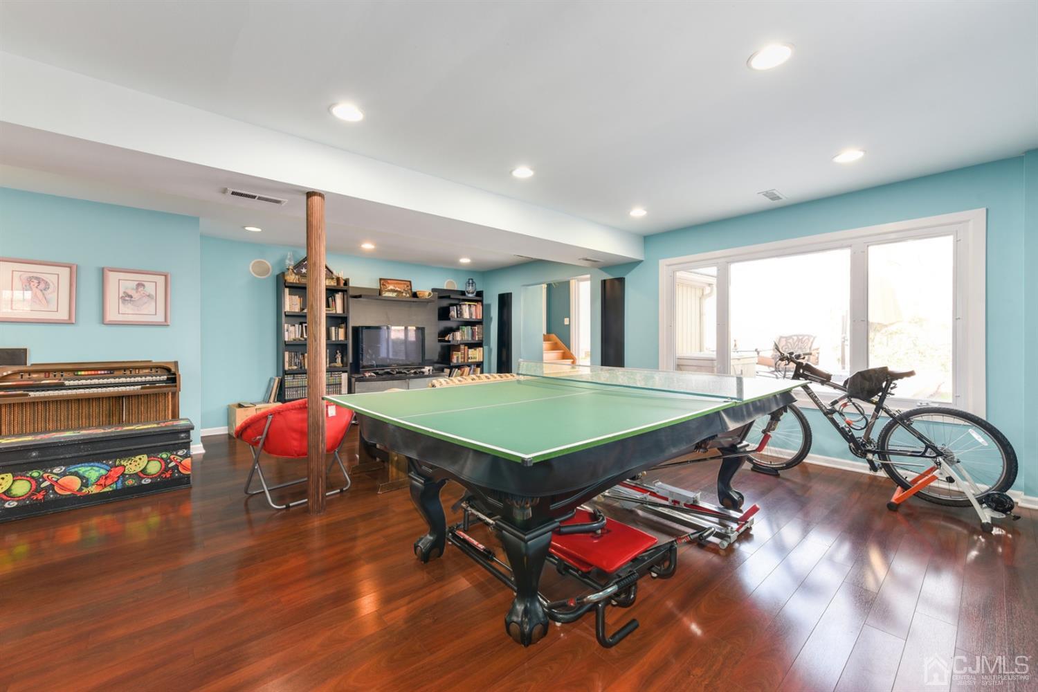 27 Agate Road East Brunswick, NJ 08816 - Photo 22 of 31 a room with furniture pool table and windows