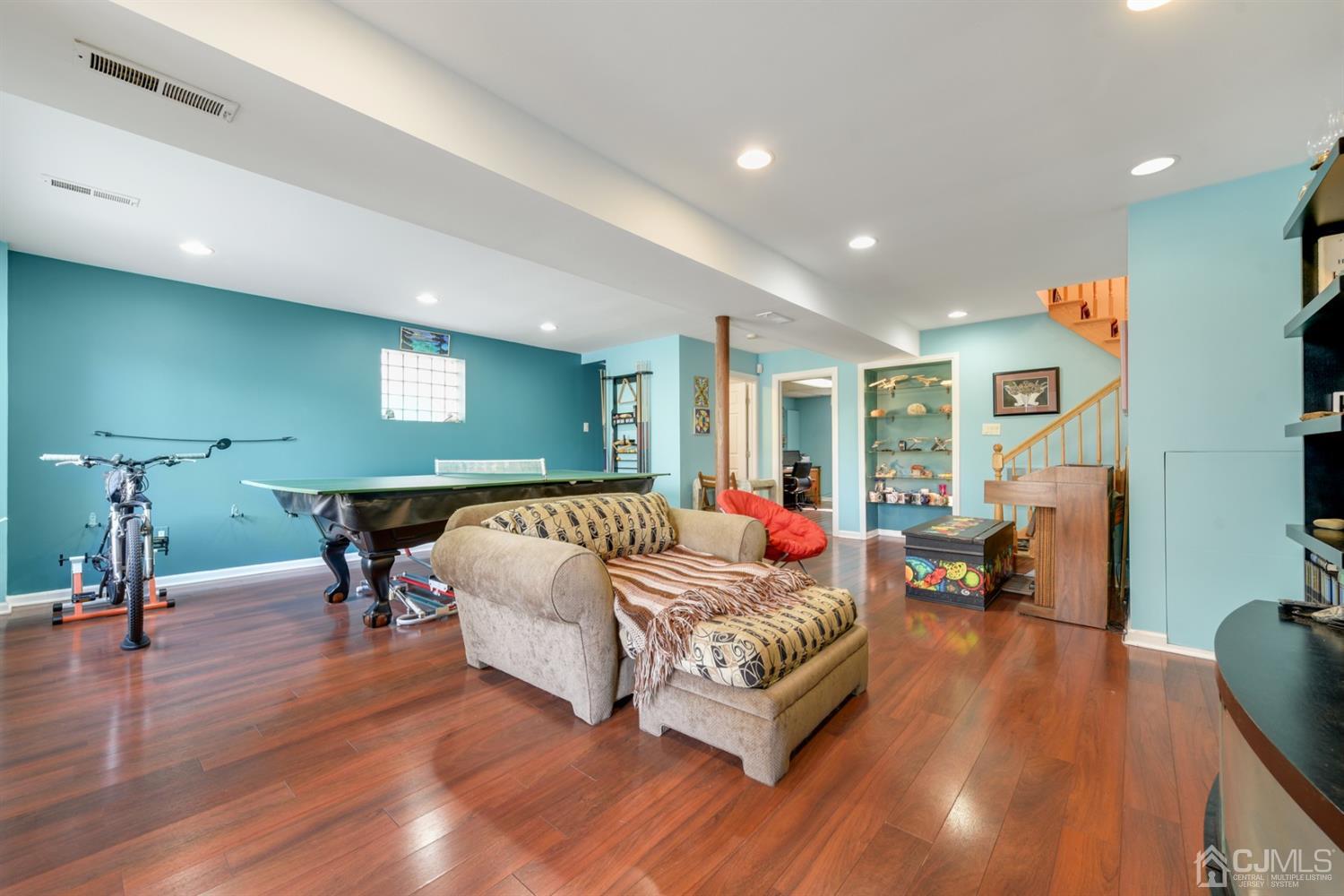 27 Agate Road East Brunswick, NJ 08816 - Photo 23 of 31 a living room with furniture and a wooden floor