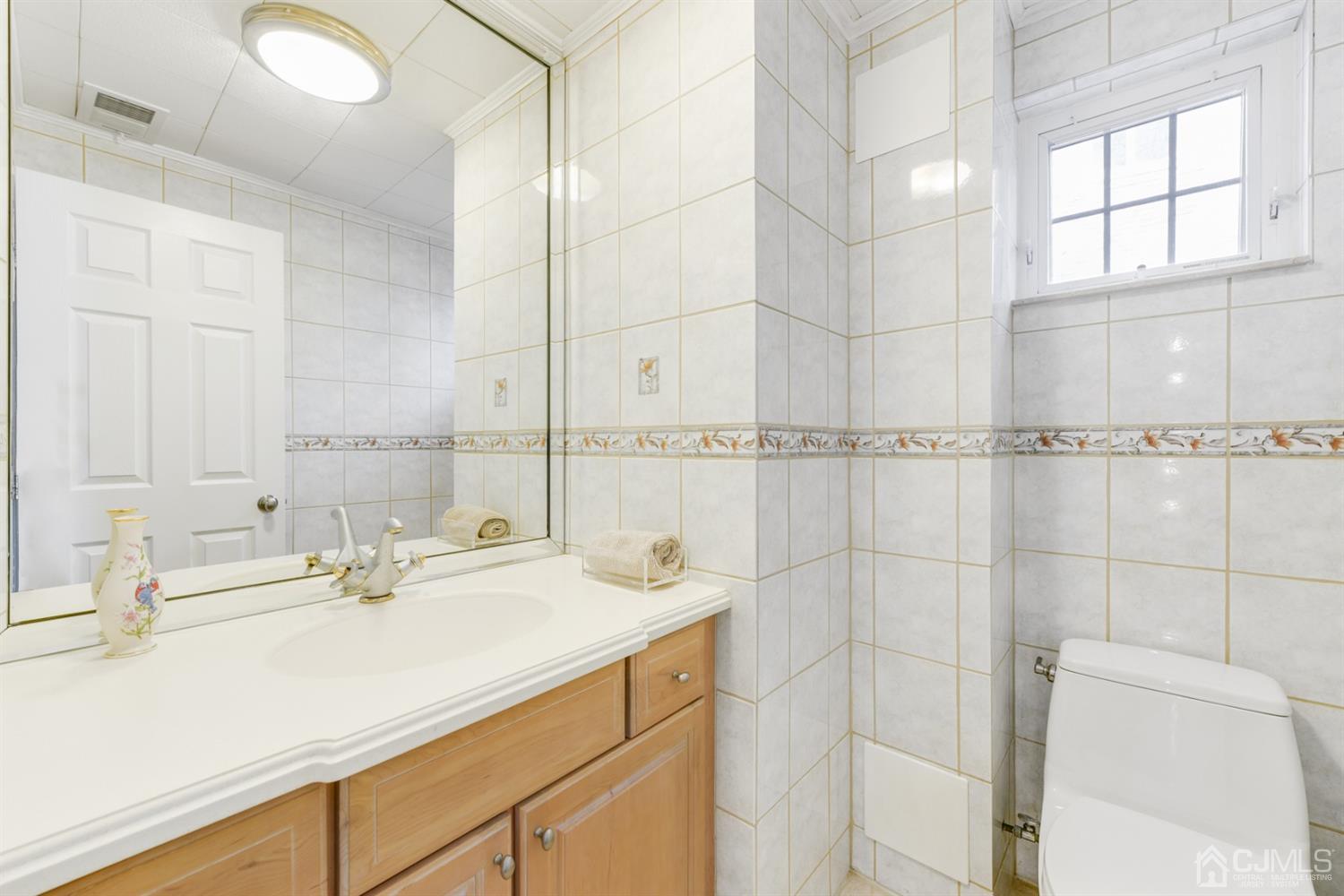 27 Agate Road East Brunswick, NJ 08816 - Photo 24 of 31 a bathroom with a sink and a shower