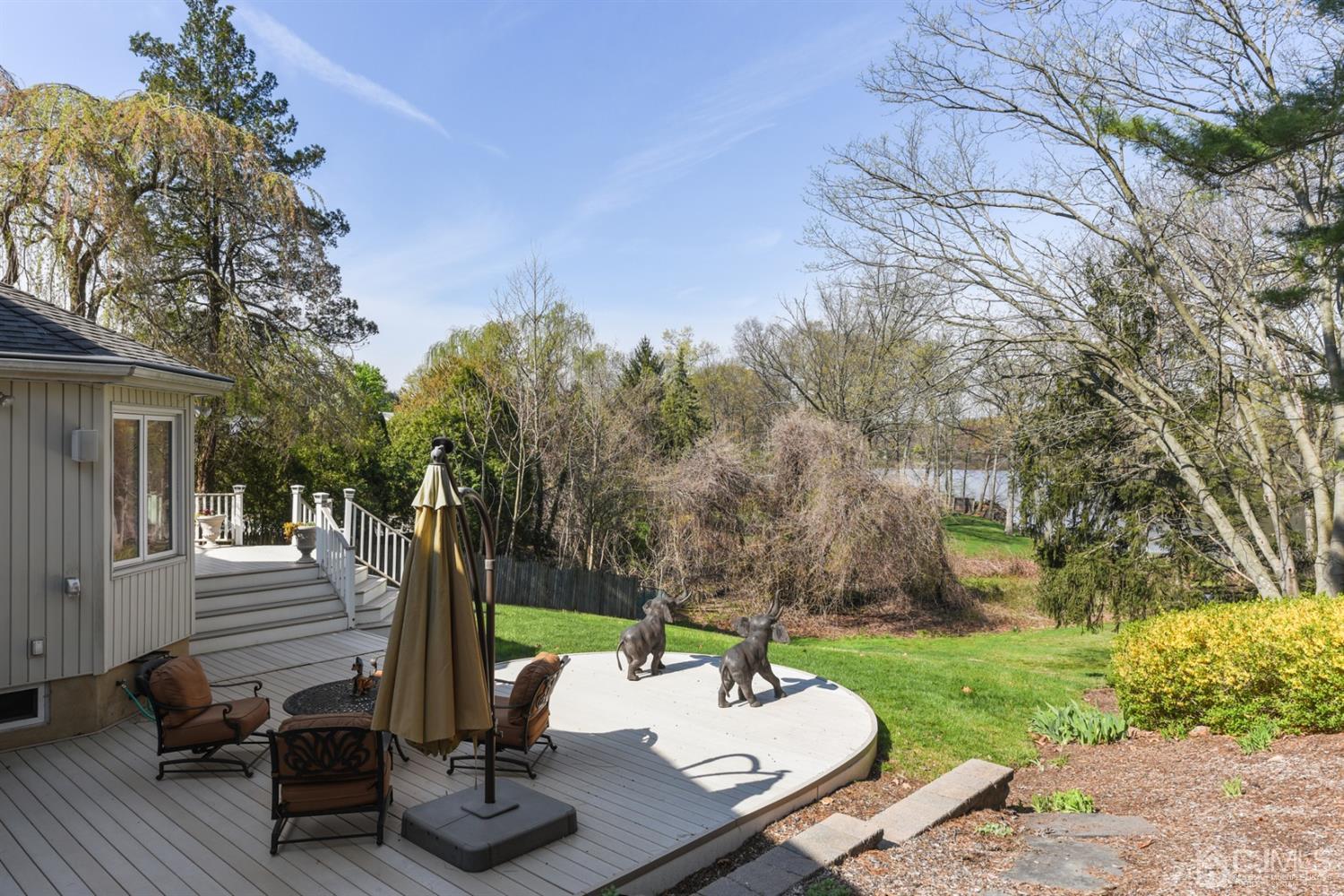 27 Agate Road East Brunswick, NJ 08816 - Photo 28 of 31 a view of a patio with a table chairs and a patio