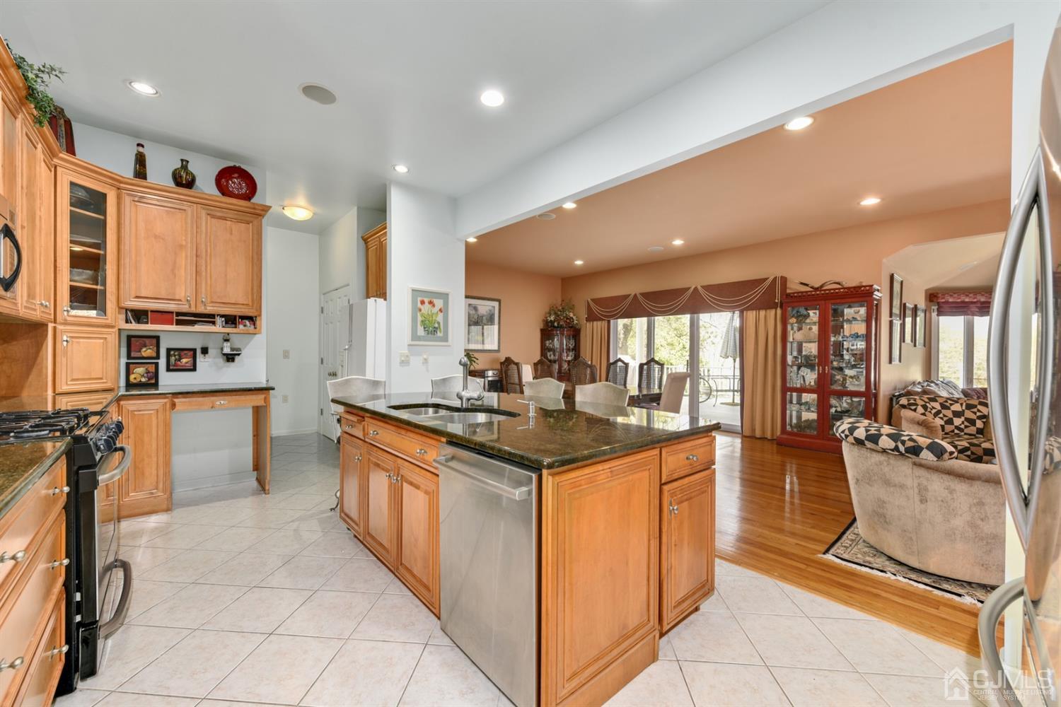 27 Agate Road East Brunswick, NJ 08816 - Photo 5 of 31 a kitchen with stainless steel appliances granite countertop a stove and a sink