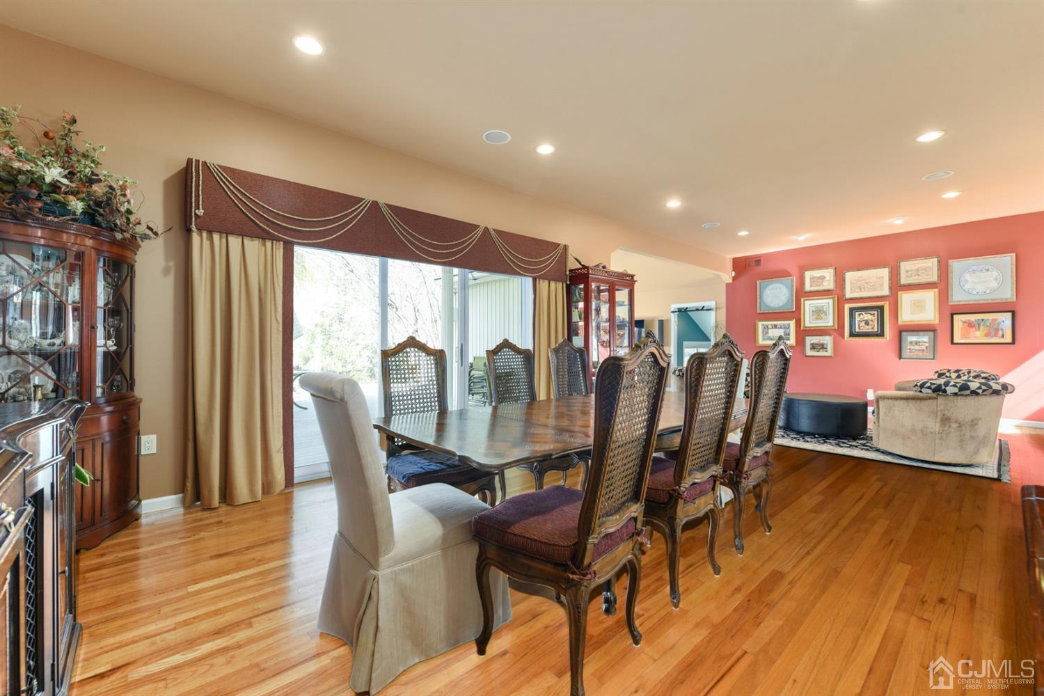 27 Agate Road East Brunswick, NJ 08816 - Photo 7 of 31 a view of a dining room with furniture and wooden floor