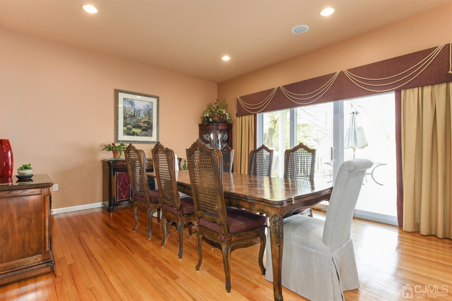27 Agate Road East Brunswick, NJ 08816 - Photo 8 of 31 a view of a dining room with furniture and wooden floor