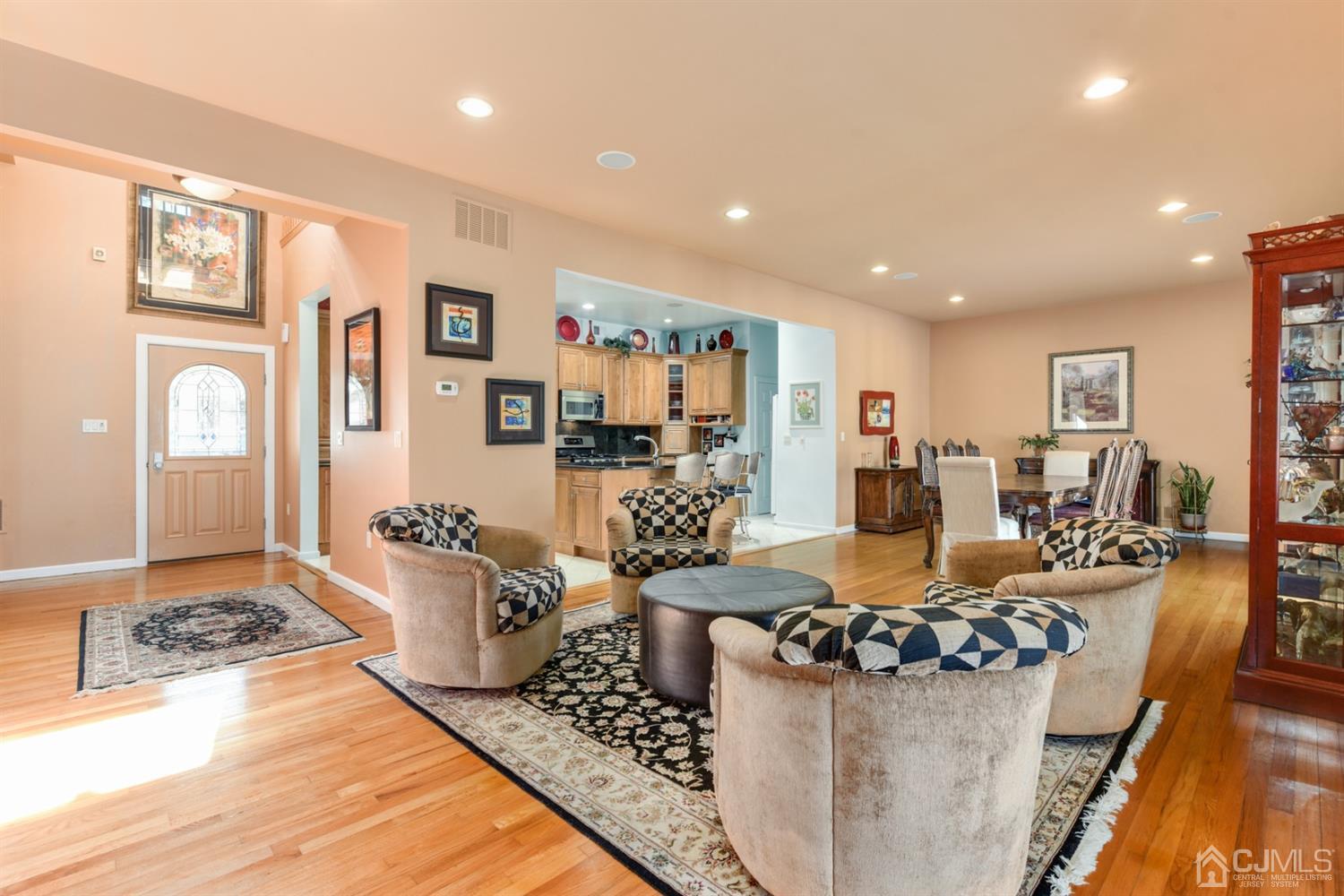 27 Agate Road East Brunswick, NJ 08816 - Photo 9 of 31 a living room with furniture and a table