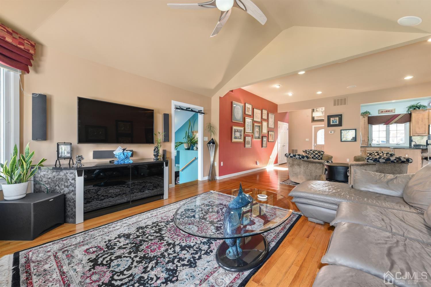 27 Agate Road East Brunswick, NJ 08816 - Photo 10 of 31 a living room with furniture and a flat screen tv