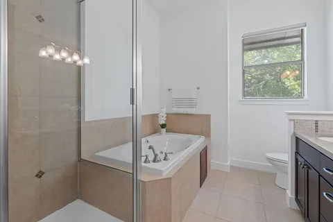 a bathroom with a bathtub and a sink