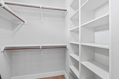 a view of an empty walk in closet