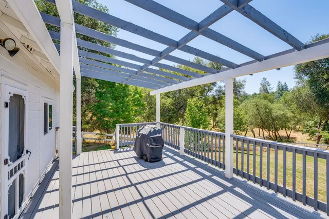 a view of a house with a garden and yard