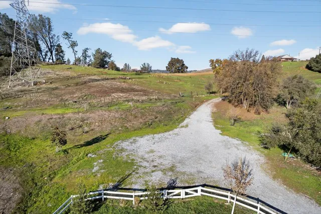 a aerial view of a house with a yard