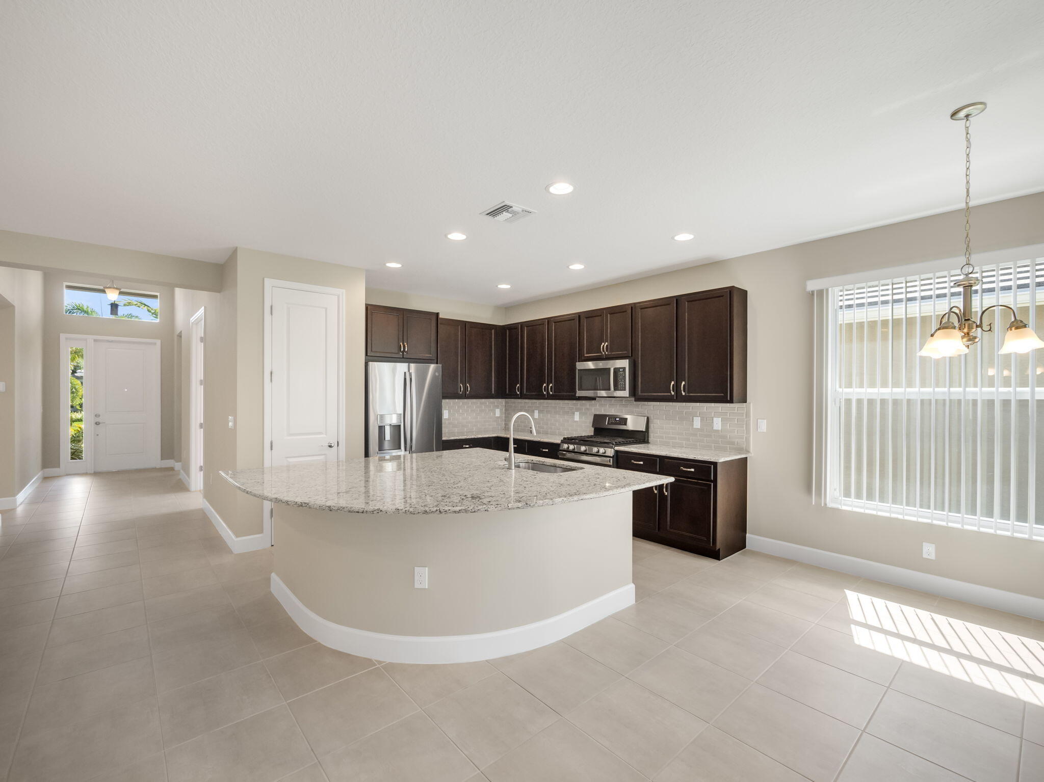 13459 Southwest Green Delta Road Port St. Lucie, FL 34987 - Photo 4 of 100 Foyer/Kitchen/Dining
