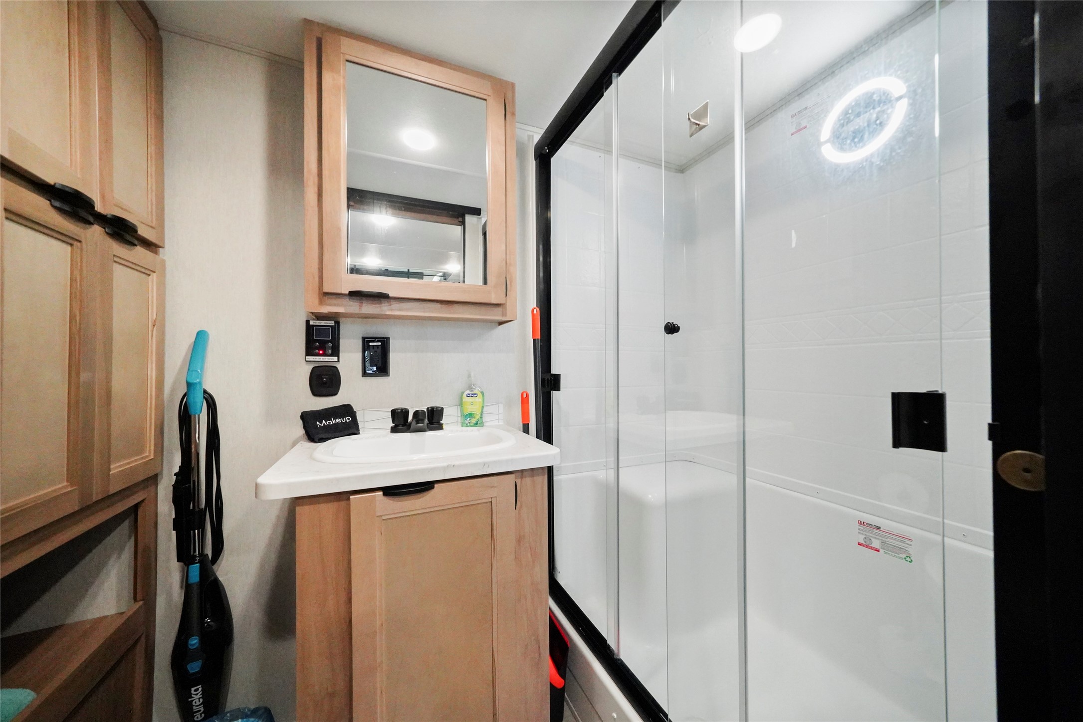 1845 Oleander Crystal Beach, TX 77650 - Photo 19 of 28 a room with a sink a refrigerator and a mirror