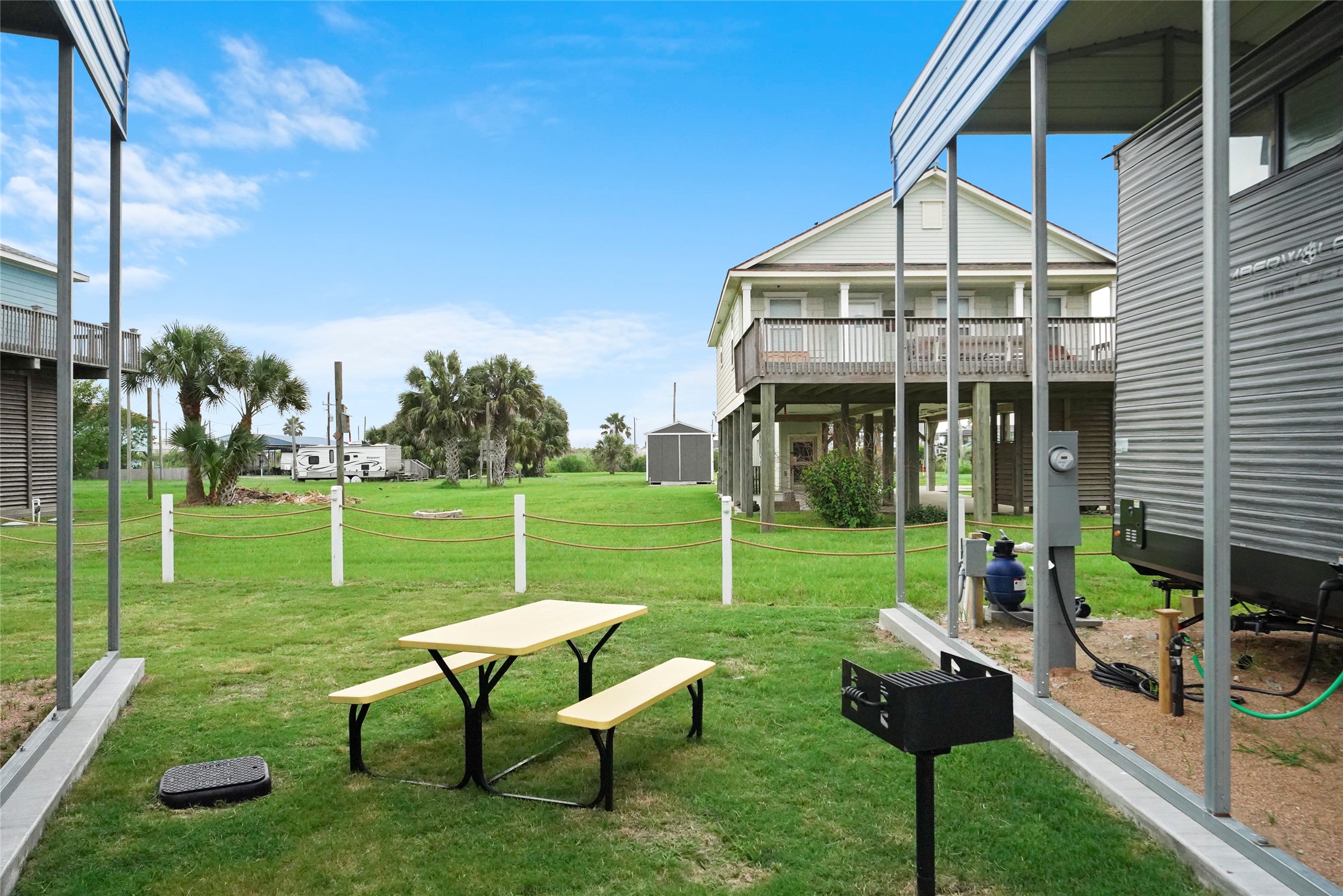 1845 Oleander Crystal Beach, TX 77650 - Photo 8 of 28 a view of a house with a yard patio and a garden