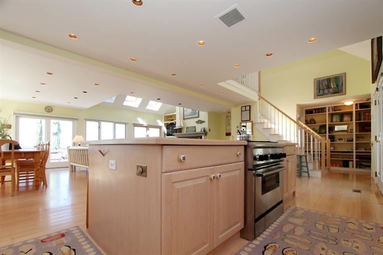 40 Bayshore Lane Eastham, MA 02642 - Photo 13 of 35 a kitchen with stainless steel appliances granite countertop a stove and a refrigerator