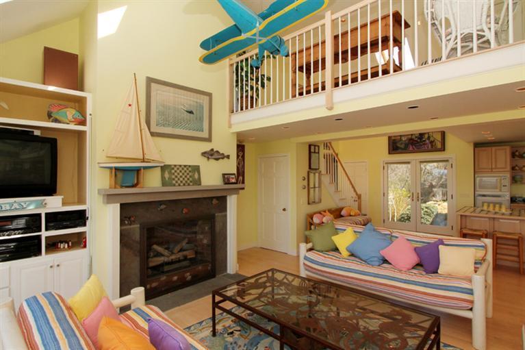 40 Bayshore Lane Eastham, MA 02642 - Photo 15 of 35 a living room with furniture fireplace and flat screen tv