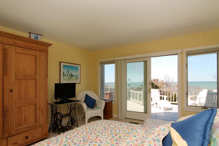 40 Bayshore Lane Eastham, MA 02642 - Photo 16 of 35 a bedroom with a bed and glass window