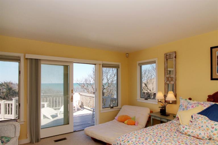 40 Bayshore Lane Eastham, MA 02642 - Photo 17 of 35 a large bedroom with a large bed and wooden floor