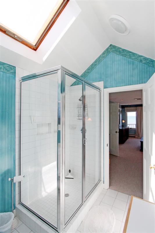 40 Bayshore Lane Eastham, MA 02642 - Photo 19 of 35 a bathroom with a shower and a glass door