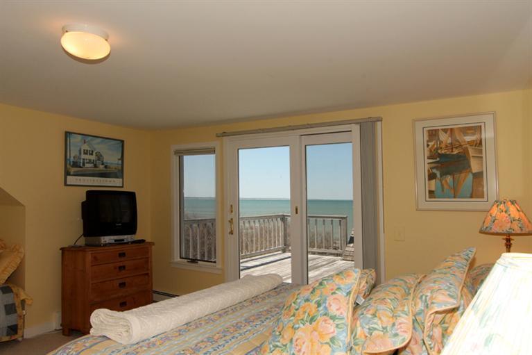 40 Bayshore Lane Eastham, MA 02642 - Photo 20 of 35 a bedroom with furniture and a flat screen tv