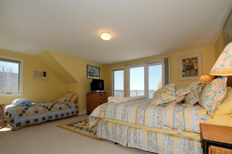 40 Bayshore Lane Eastham, MA 02642 - Photo 21 of 35 a bedroom with double bed and a window