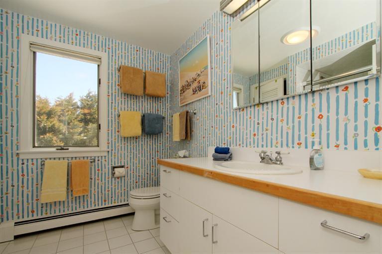 40 Bayshore Lane Eastham, MA 02642 - Photo 22 of 35 a bathroom with a sink a toilet and a mirror