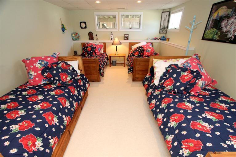 40 Bayshore Lane Eastham, MA 02642 - Photo 26 of 35 a bedroom with two beds and a chandelier