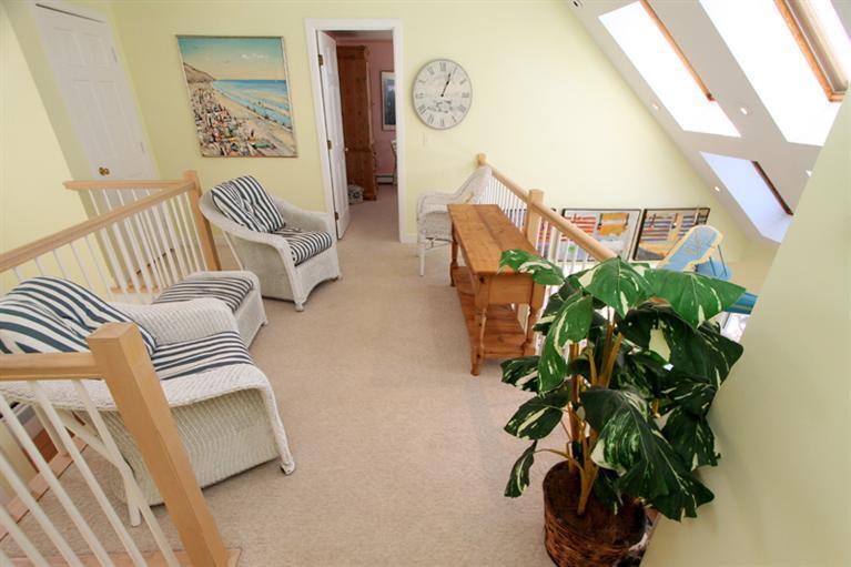 40 Bayshore Lane Eastham, MA 02642 - Photo 28 of 35 a vase of flowers sitting on a table